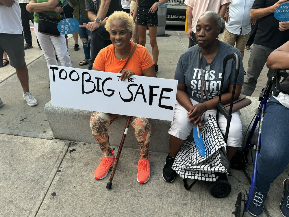 Clinton Hill neighbors mount protest Tuesday night against a complex of shelters for migrants in their neighborhood. The complex near the Brooklyn Navy Yard serves some 4,000 migrants, mostly asylum-seekers. The neighbors say that's too many for one location.