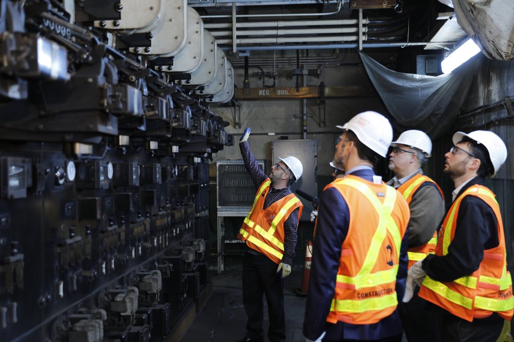 An MTA official points to heavy duty electrical equipment.