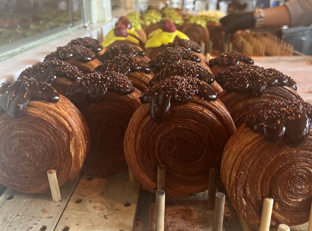 Rows of spiral-shaped croissants.