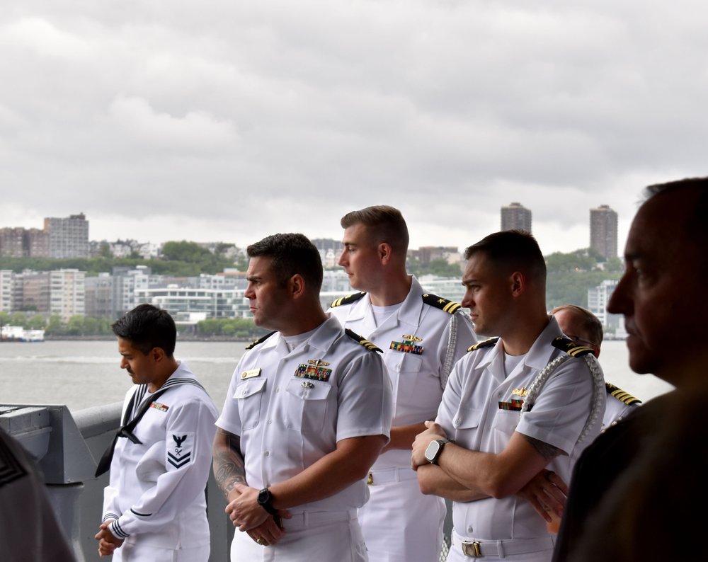 Sailors in dapper white unifroms aboard the Intrepid Museum.