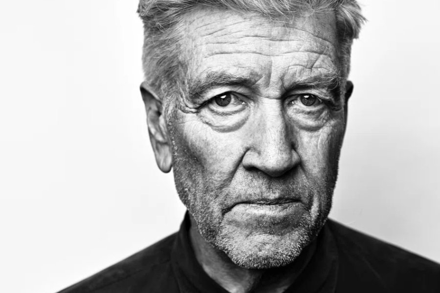 A close-up black and white image of a man's face