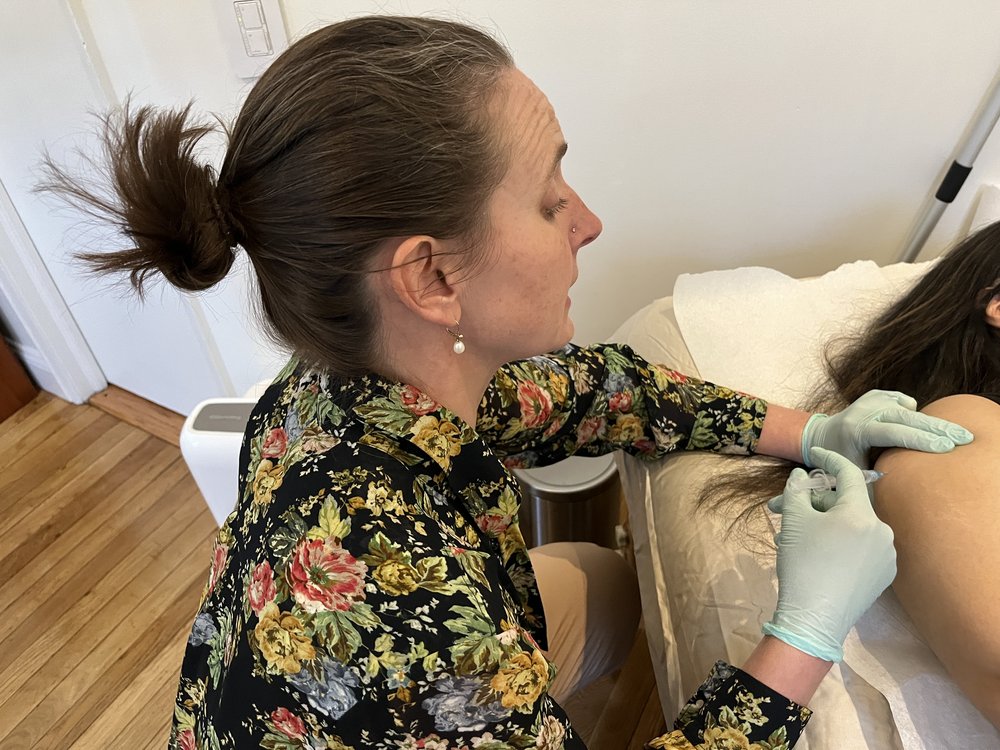 Dr. Rebecca Summers gives Alisha a dose of NAD, a supplement that's supposed to increase her energy. There are currently no FDA-approved treatments for long COVID.