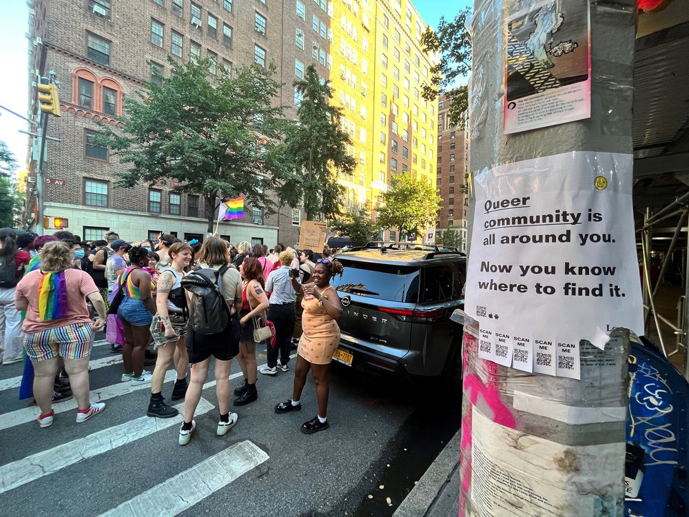 People marching on the street, in the distance