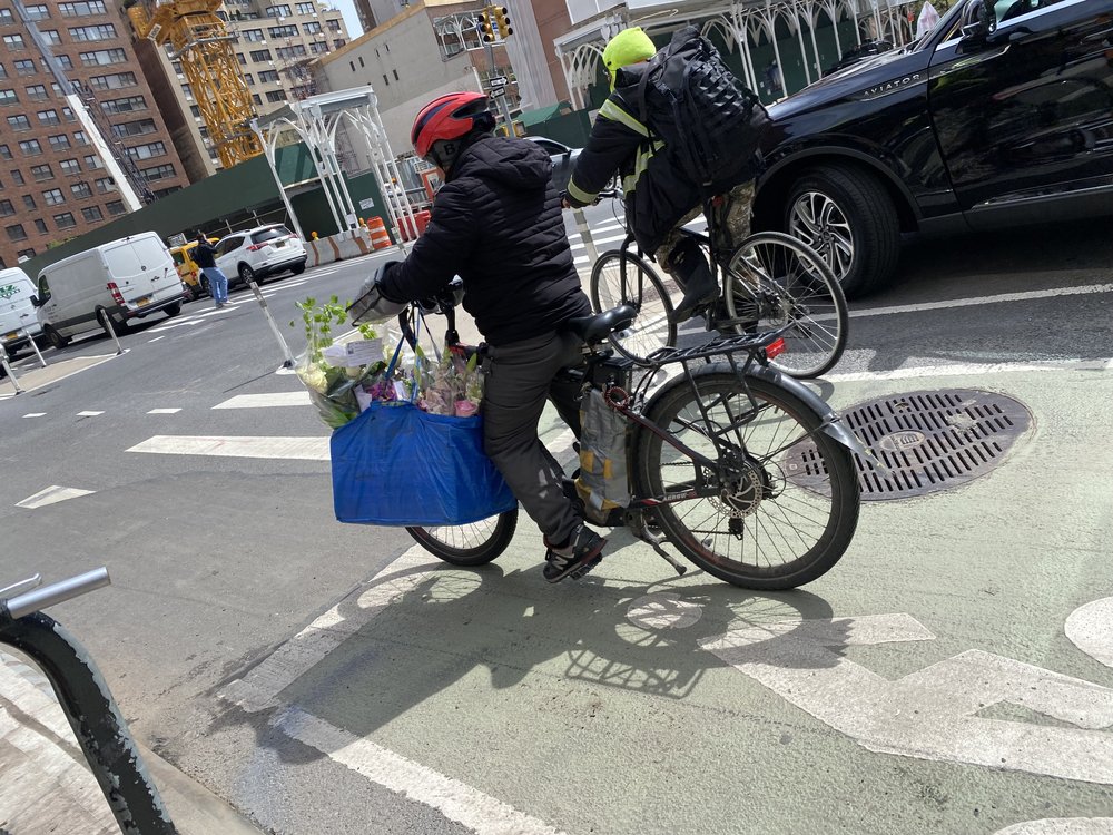 E-bikers in a crosswalk