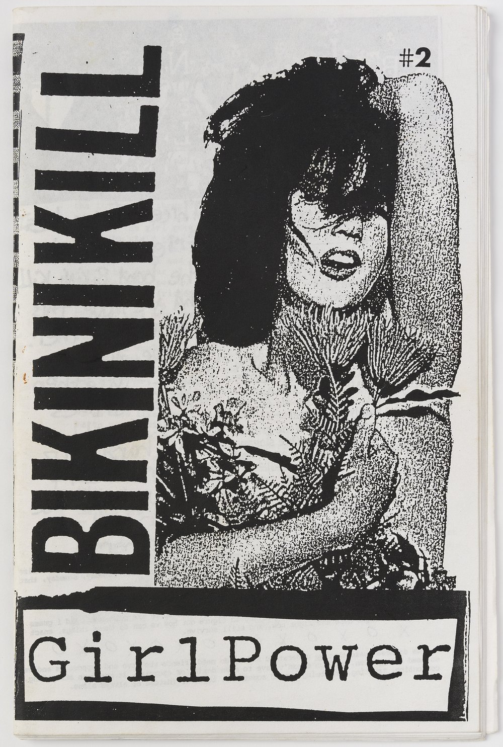 a black and white zine with a woman on the cover