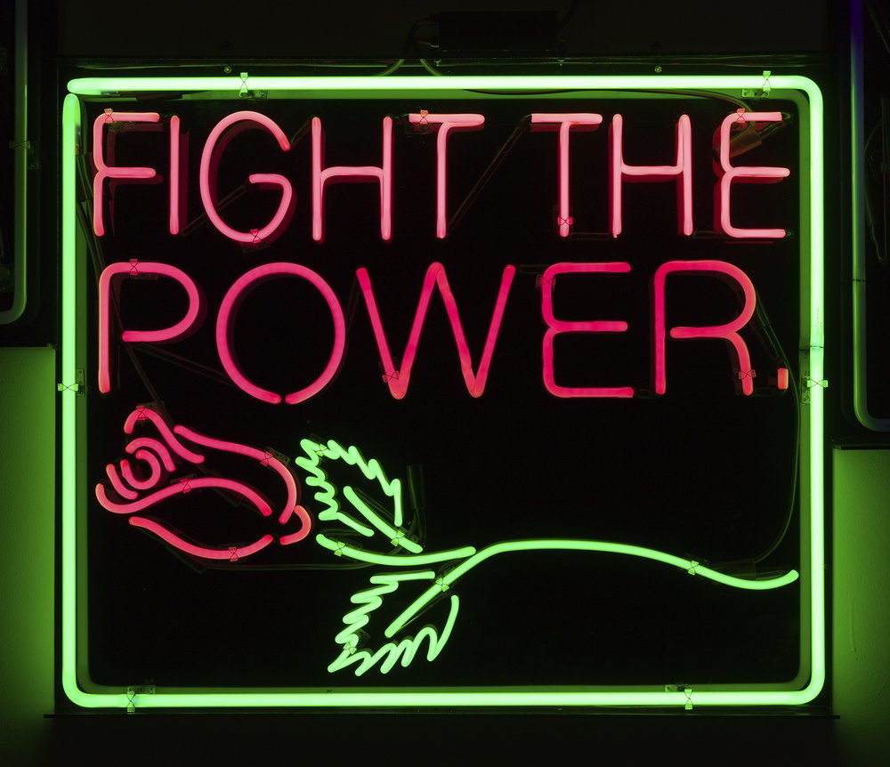 A sign that says "Fight the Power"