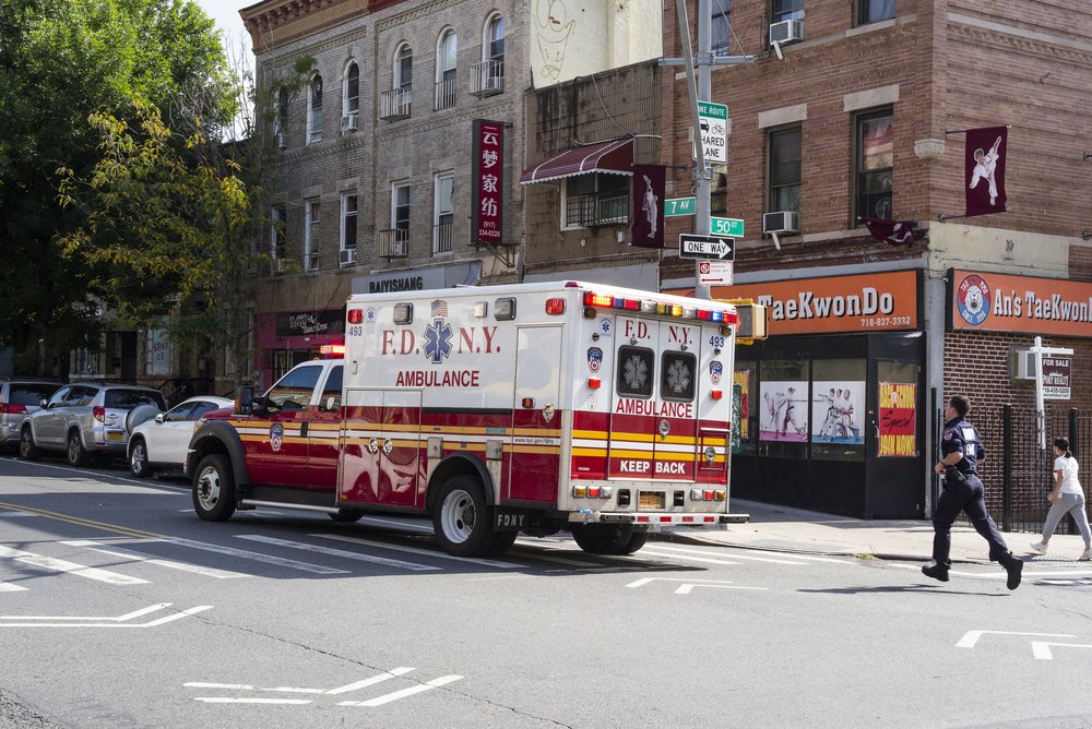 EMT Daniel Surat runs to board an ambulance heading out on an emergency call.
