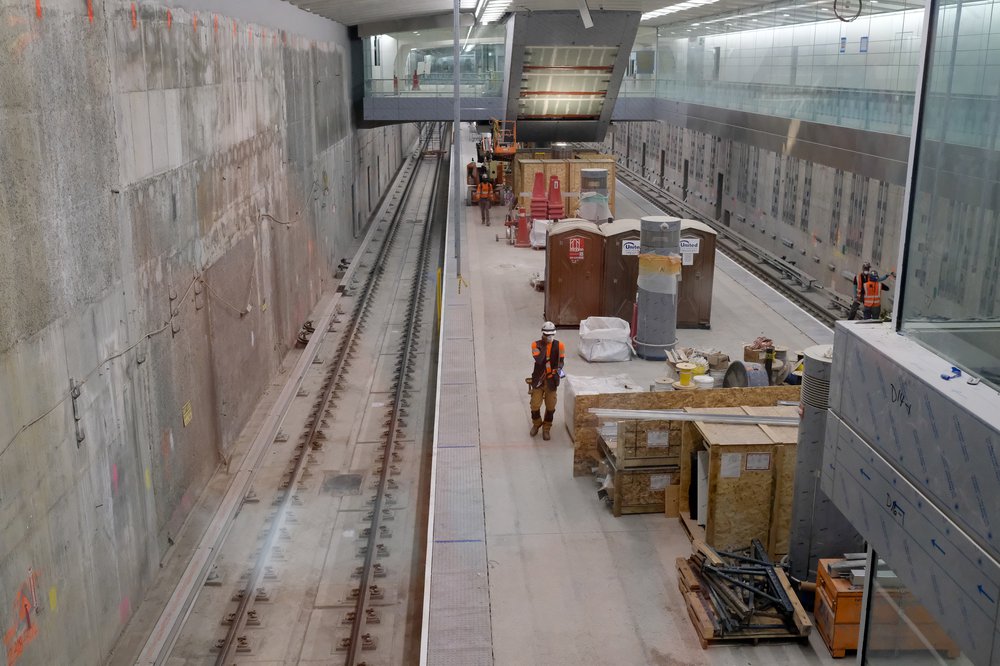 An aerial view of workers and boxes of materials on the platform