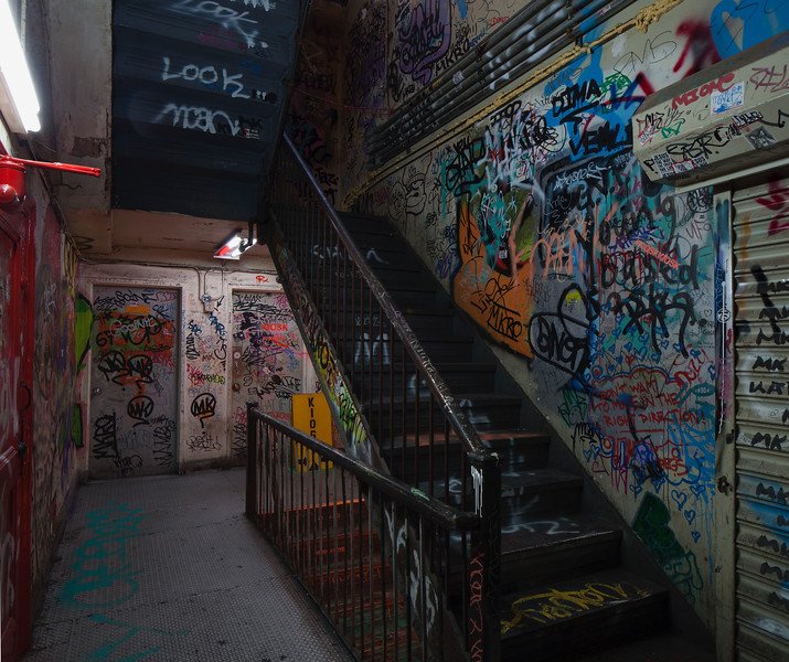 A staircase covered in graffiti