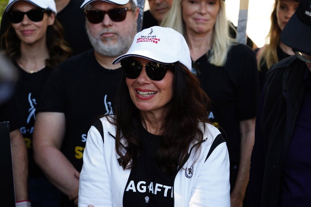 A photo of Fran Drescher walking the picket line with striking WGA and SAG-AFTRA members on July 14, 2023 in Burbank, California.