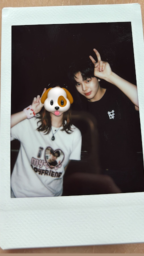 A person poses with their idol