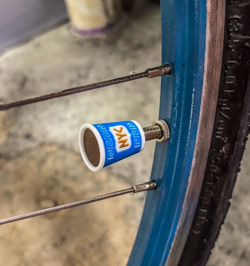 Photo of a bike tire valve cover made by Gino Santaguida