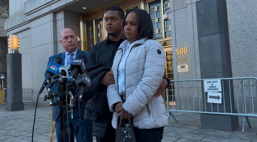 Otoniel Feliz and his wife, Zoila Dominici, speak to press outside Manhattan federal court.