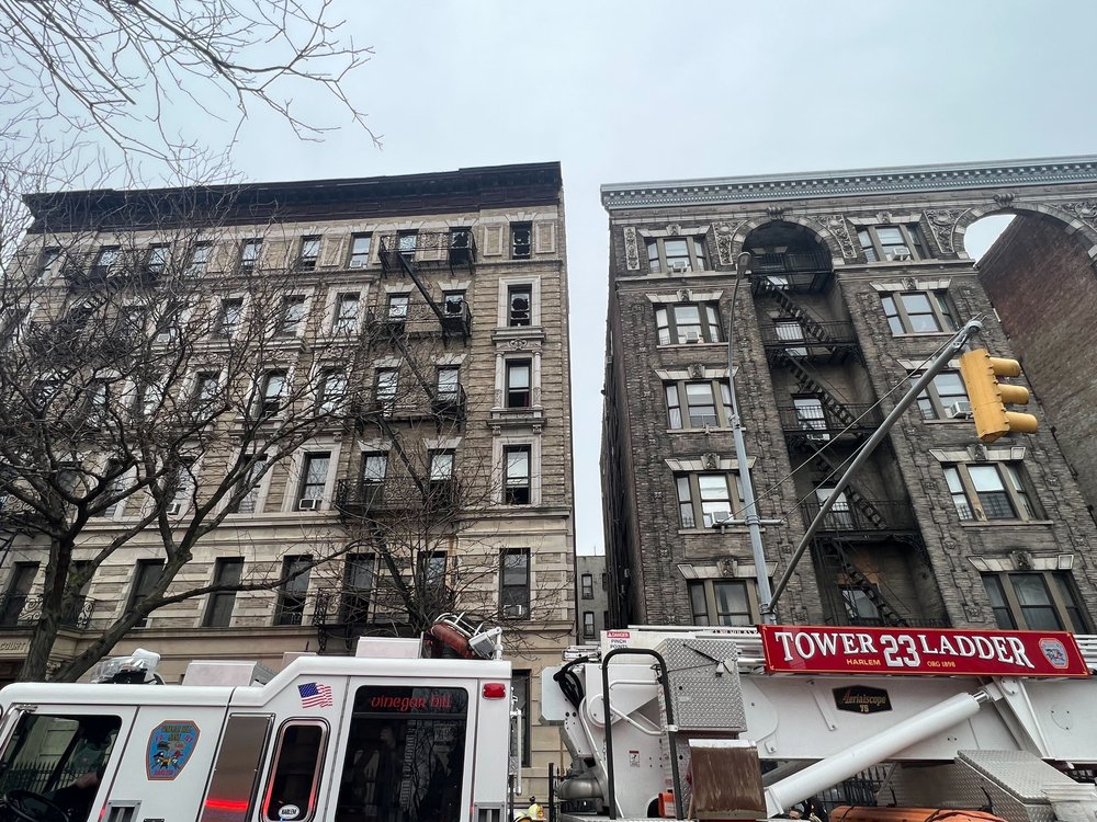 Firefighters respond to a fire at a building in Harlem on Feb. 23, 2024. One person was declared dead and more than a dozen others were injured.