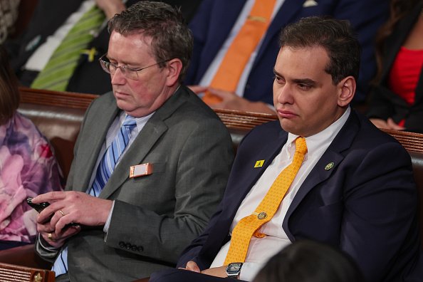 A close-up of George Santos wearing a yellow tie during the State of the Union.