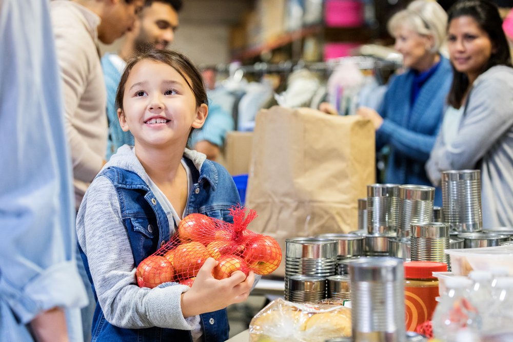 Stock photo of a person receiving food donations.