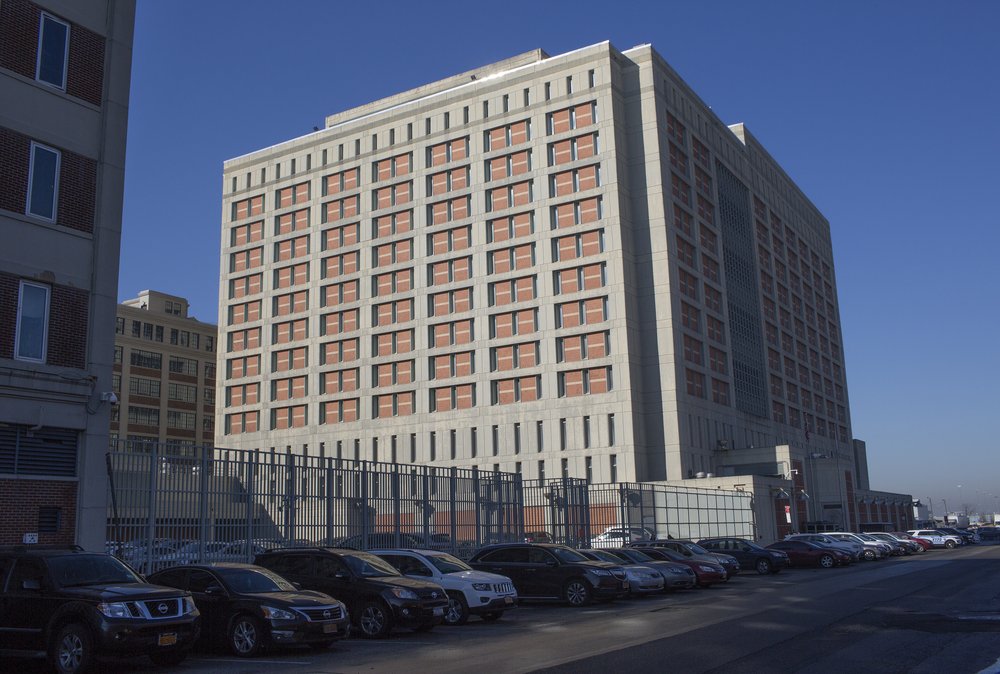 The exterior of a large, block-shaped building: The Metropolitan Detention Center in Sunset Park, in 2019.