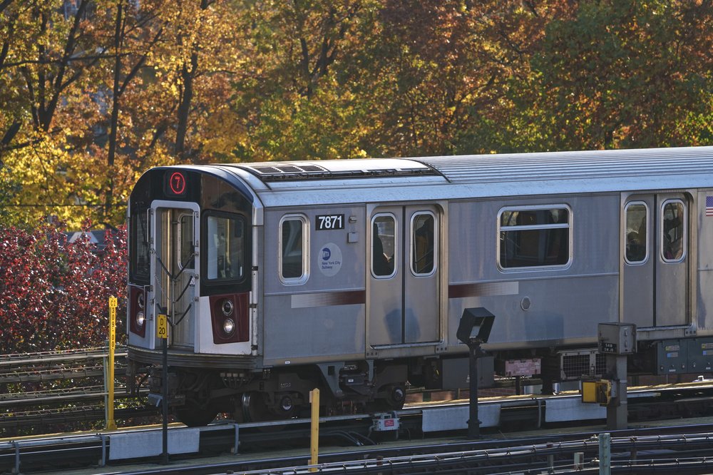 A 7 train runs on an elevated subway track in 2018.