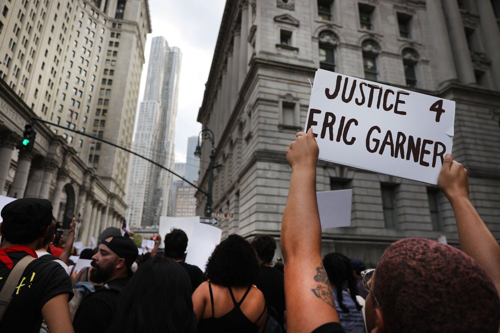 Activists Mark Five Year Anniversary Since Death Of Eric Garner, Day After DOJ Announced No Federal Charges For NYPD Officer NEW YORK, NEW YORK - JULY 17: People participate in a protest to mark the five year anniversary of the death of Eric Garner during a confrontation with a police officer in the borough of Staten Island on July 17, 2019 in New York City. Yesterday it was announced that federal prosecutors will not charge New York City Police Officer Daniel Pantaleo in the death of Garner, who repeated the phrase "I can't breathe" almost a dozen times while being arrested for an alleged misdemeanor.