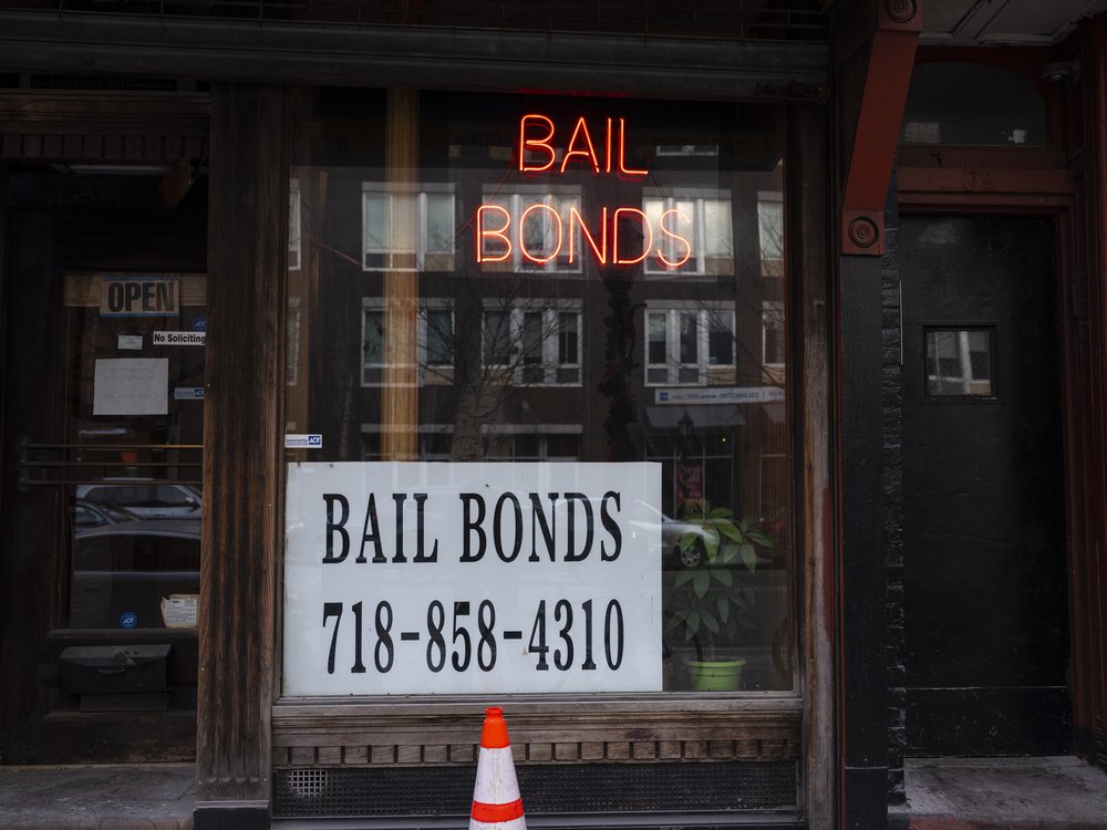 A sign advertises services for bail bonds along Atlantic Avenue near the Brooklyn Detention Complex in Brooklyn, New York, December 21, 2019. A state license is required to be a bail bondsman.