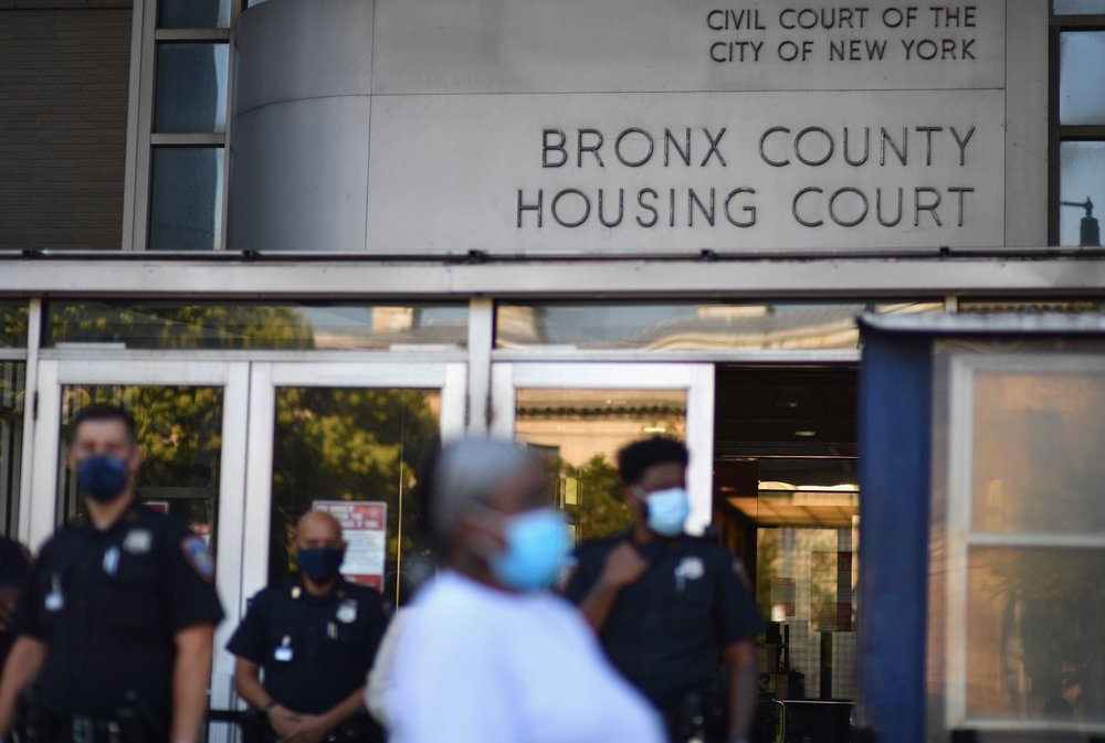 Community members protest against evictions and in support of the movement to "cancel rent" outside the Bronx housing court on August 10, 2020 in the Bronx borough of New York City.