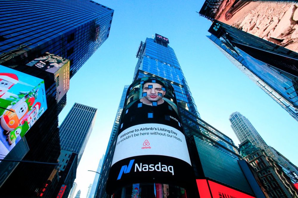 The Airbnb logo is displayed on a billboard in Times Square for the company's Wall Street debut.