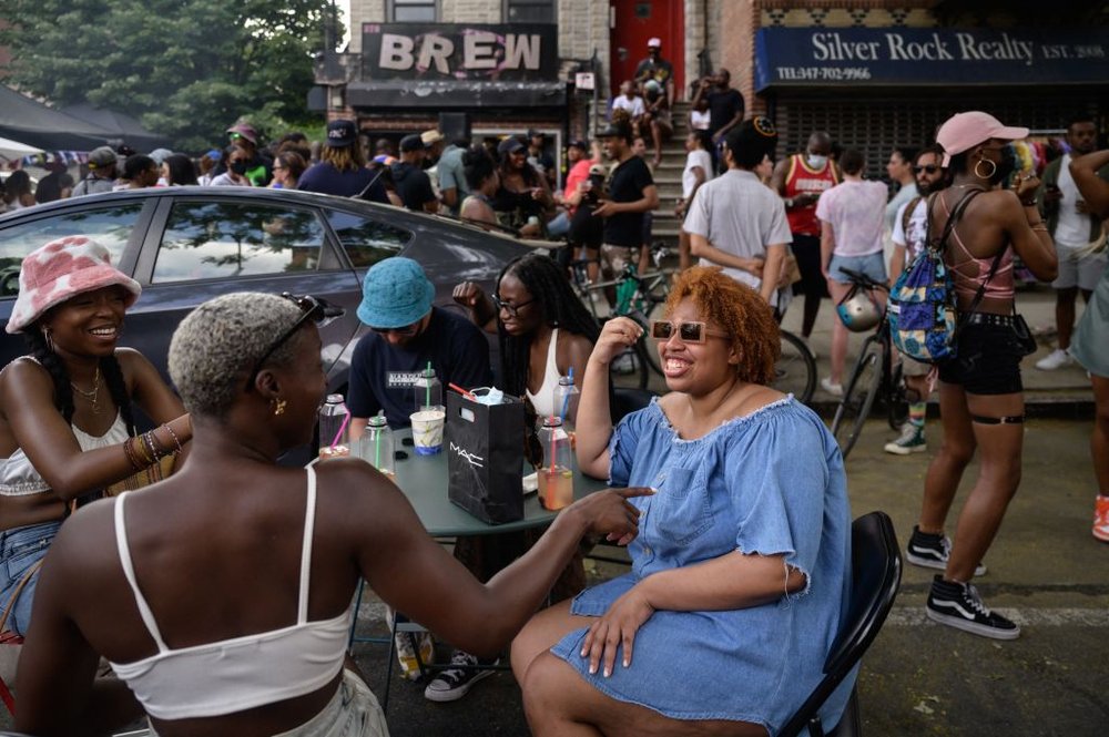 Neighbors attend a block party in Bed-Stuy, Brooklyn, on May 23, 2021.