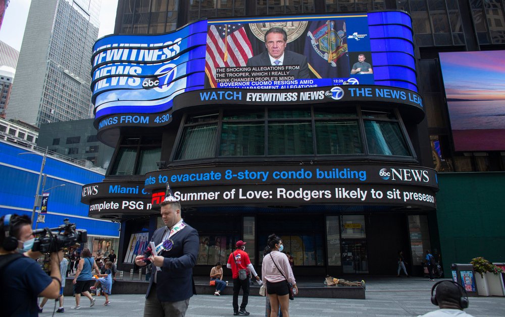 A screen in Times Square displays ex-Gov. Andrew Cuomo's resignation.