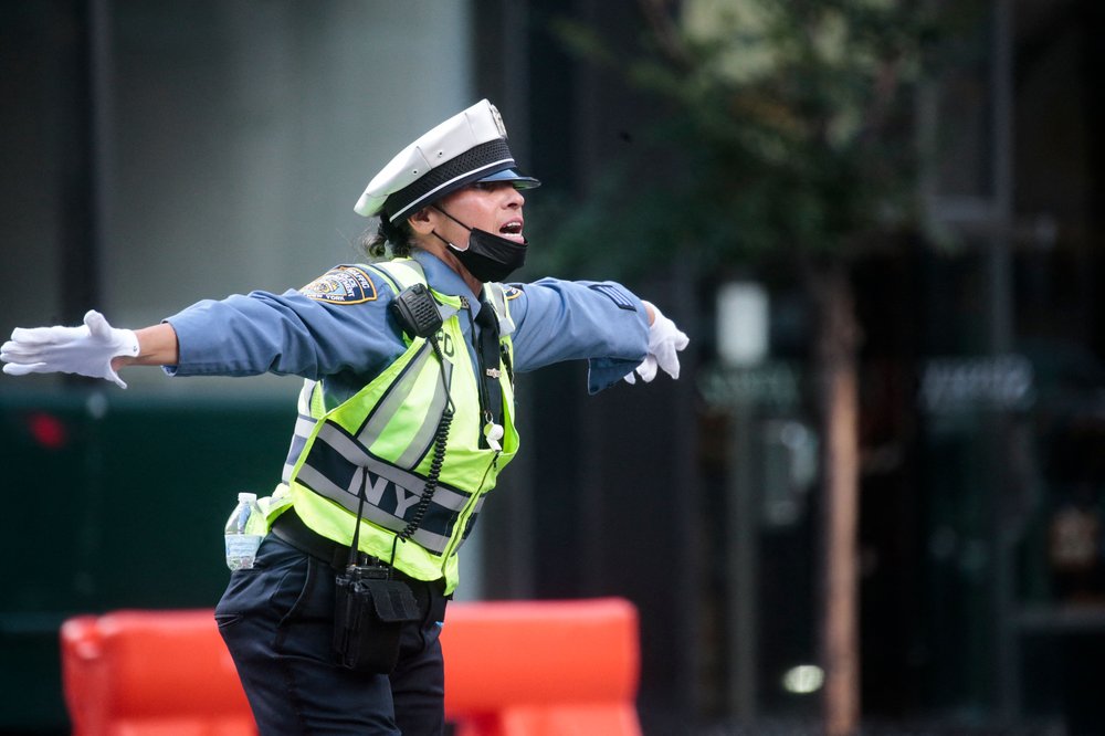 A police traffic officer gestures as traffic is restricted due to the U.N. General Assembly in 2021.