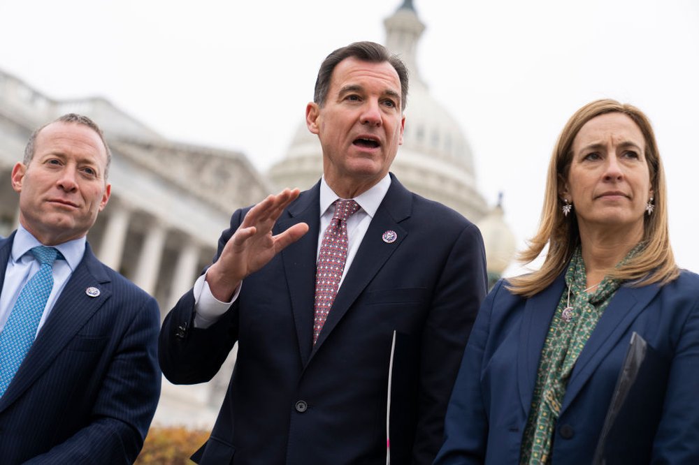 Former Rep. Tom Suozzi, flanked by Democratic members of Congress, hold a press conference outside of the U.S. Capitol building.