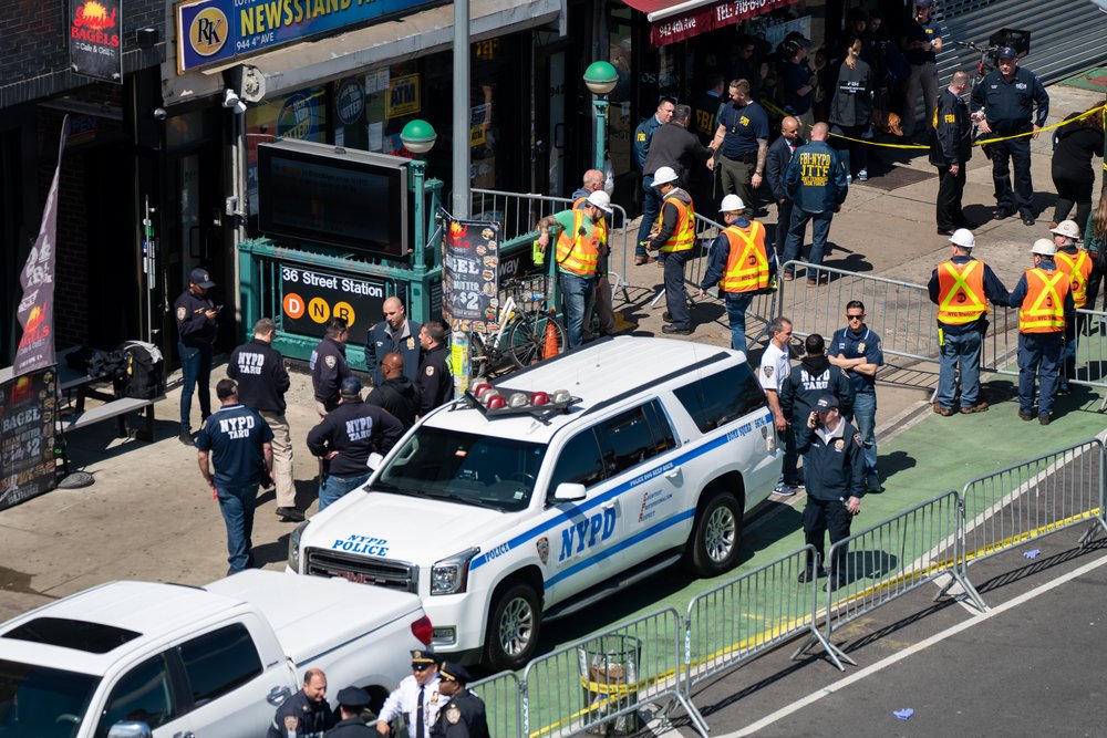 Shooting At Brooklyn Subway Stop During Morning Commute Injures Multiple People NEW YORK, NY - APRIL 12: Members of the NYPD gather at the site of a shooting at the 36 St subway station on April 12, 2022 in New York City. According to authorities, at least 29 people were reportedly injured, including 10 with gunshot wounds, during a shooting at the 36th Street and Fourth Avenue station in the Sunset Park neighborhood.