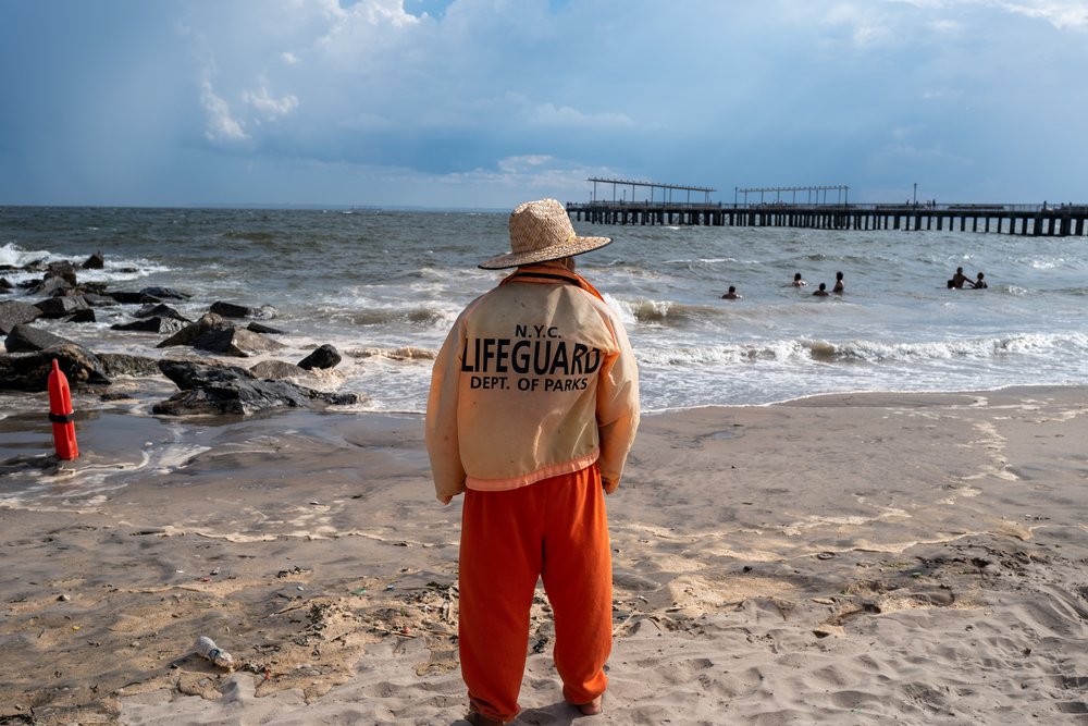 A lifeguard patrols the waters at Coney Island in Brooklyn.
