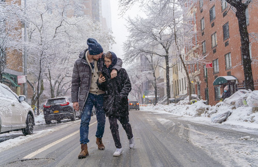 A couple in NYC during a snowstorm.