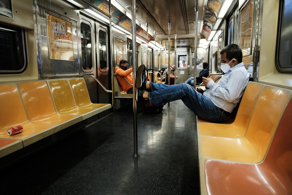 Man riding the NYC subway in 2021.