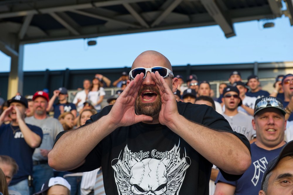 Bald Vinny Milano participates in roll call with the Bleacher Creatures at the Toronto Blue Jays vs the New York Yankees game at Yankee Stadium on May 24, 2011.