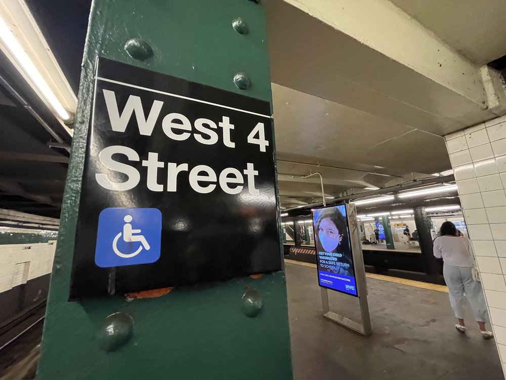 A sign for the West 4th Street Subway, inside the station.