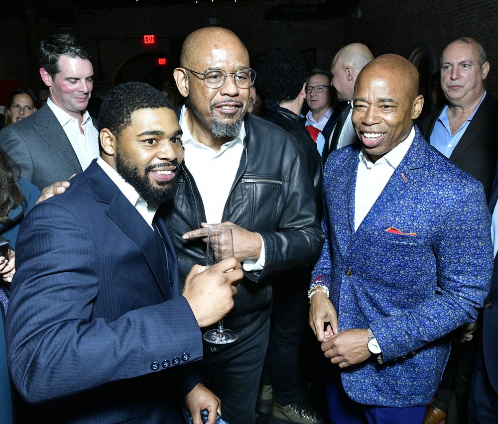 Eric Adams, Forest Whitaker and Eric Adams' son smile for the cameras.