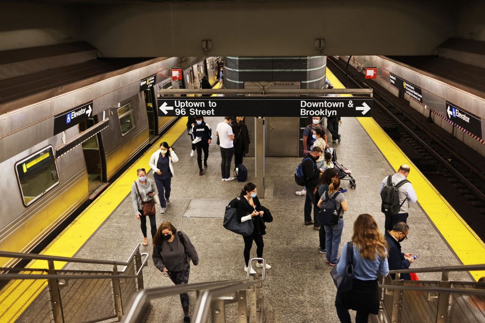 commuters head to the subway