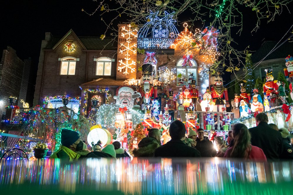 A house is heavily decorated with lights and figurines in Dyker Heights.