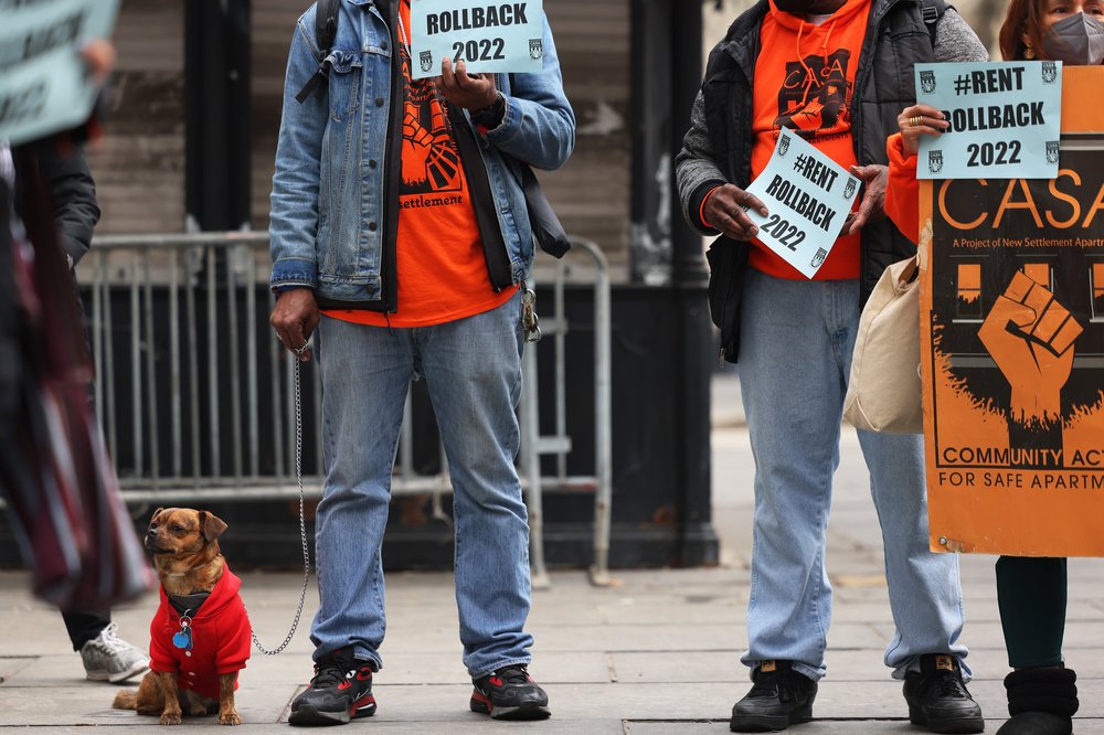 People gather to protest rent guidelines outside of City Hall for a rally on March 31st, 2022.