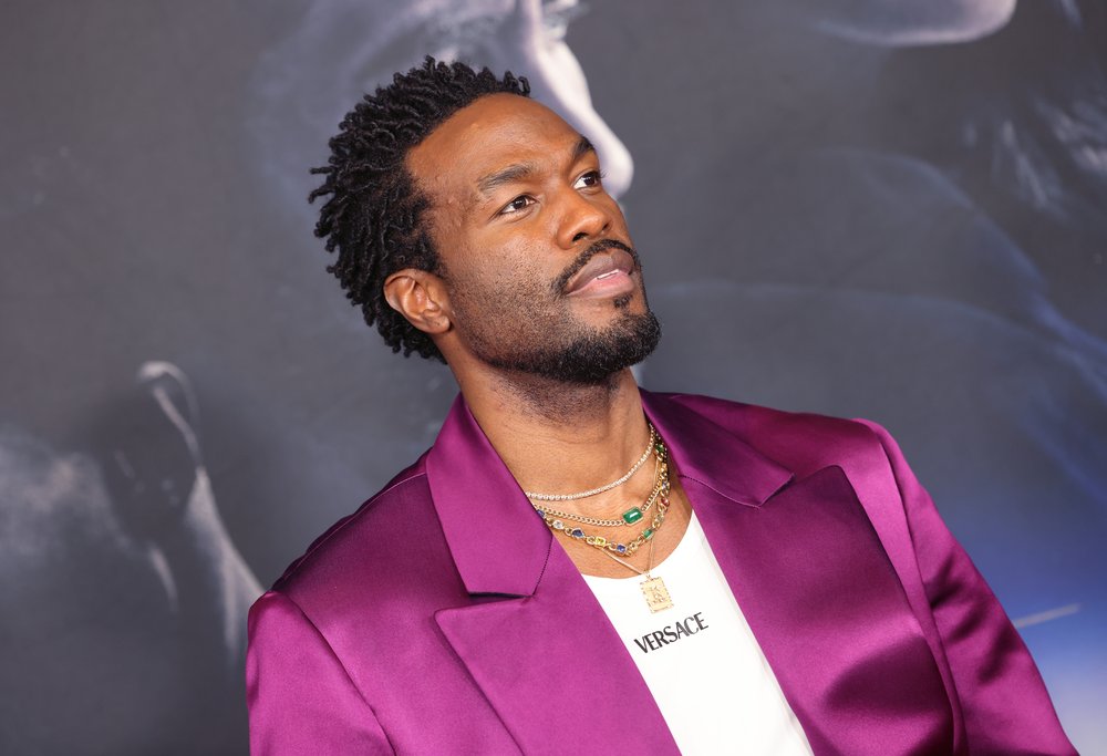An actor in a brightly colored jacket.