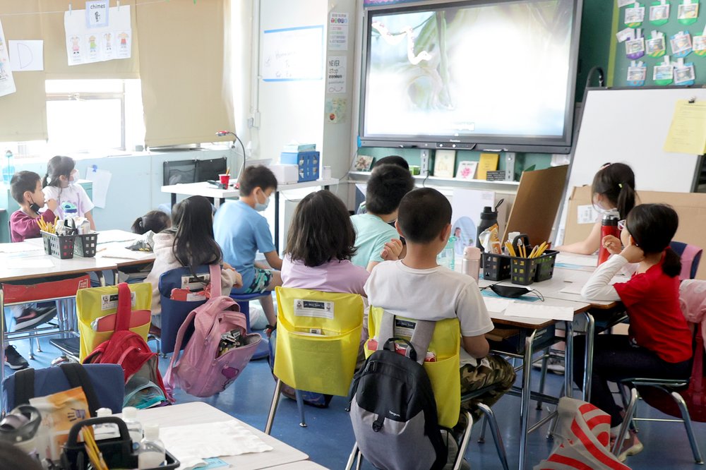 Young students sit in a New York City classroom.
