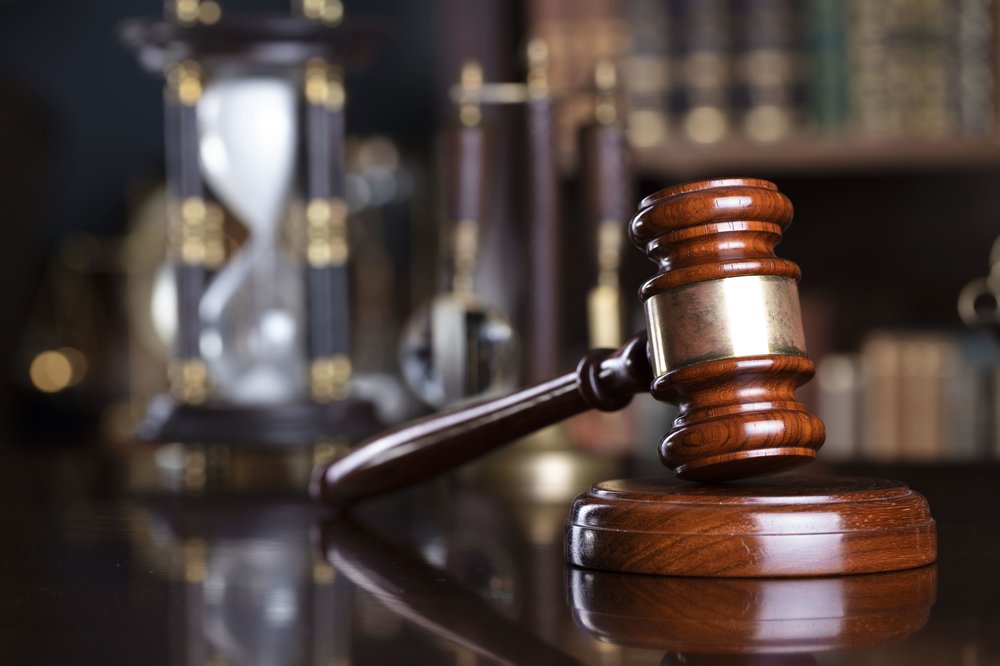 Gavel and scale on the judge desk.