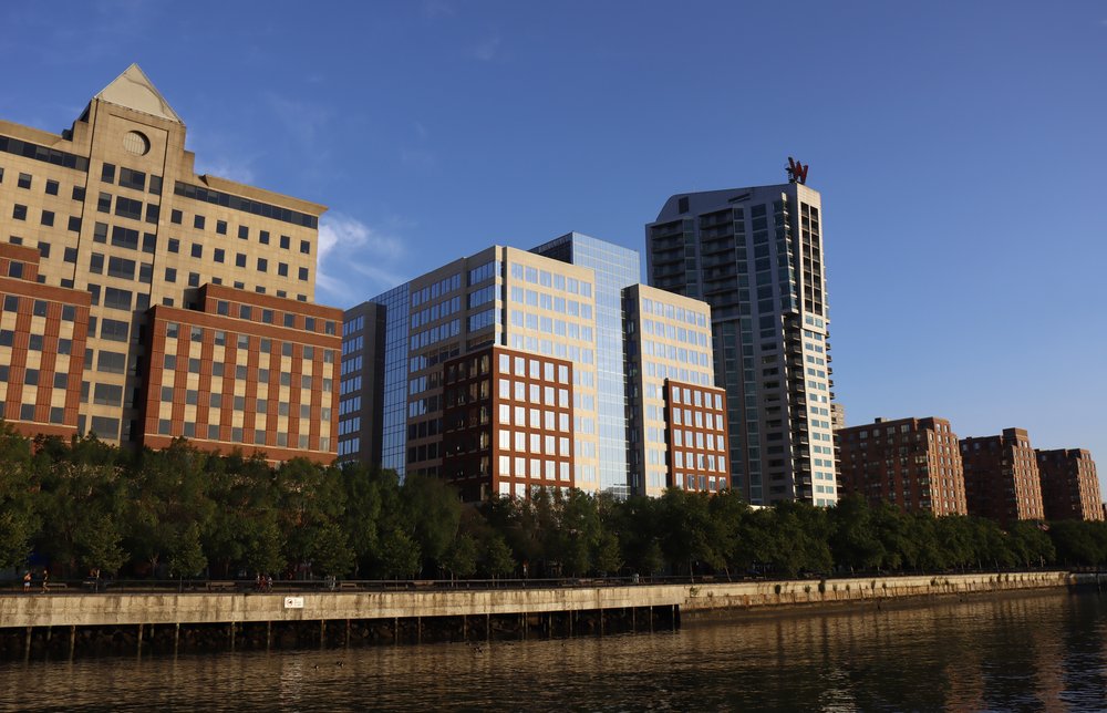 The sun rises on buildings along the Hudson River on July 19, 2022, in Hoboken, New Jersey.