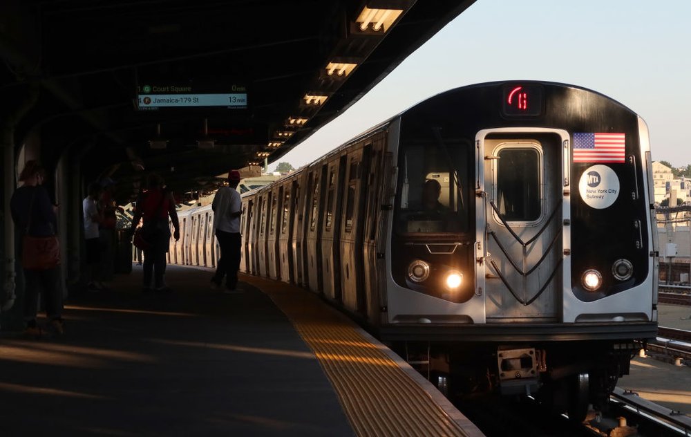 A G train arrives at the Smith-9th Streets subway station as people wait on the platform in Brooklyn on Aug. 3, 2022.