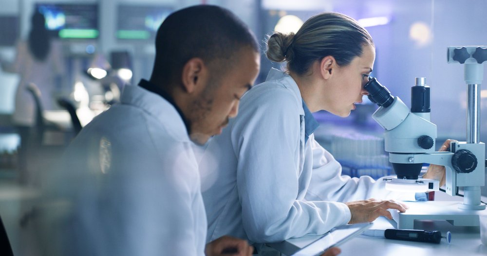 Image of two lab technicians at work