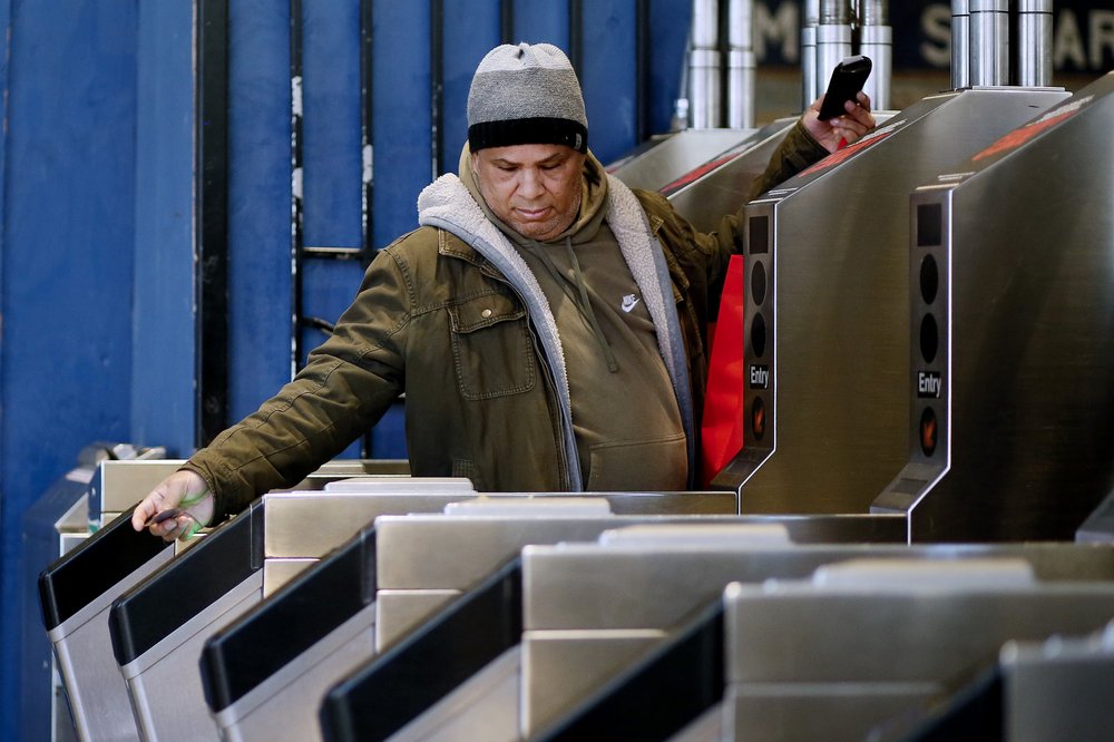 A man walks through Times Square Subway Station in December 2022.