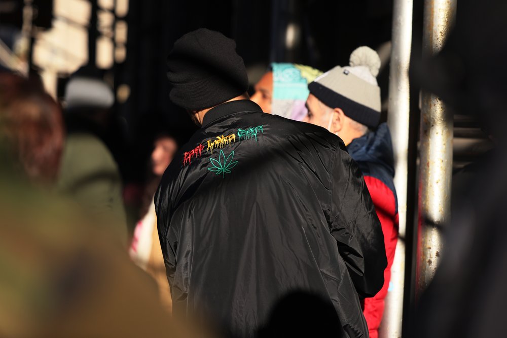 People wait in line for the 4:20 p.m. grand opening of Housing Works Cannabis Co. on Dec. 29.