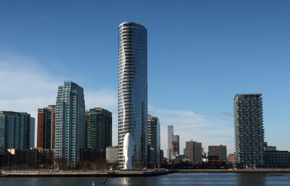 A row of apartments buildings under a blue sky in New Jersey.