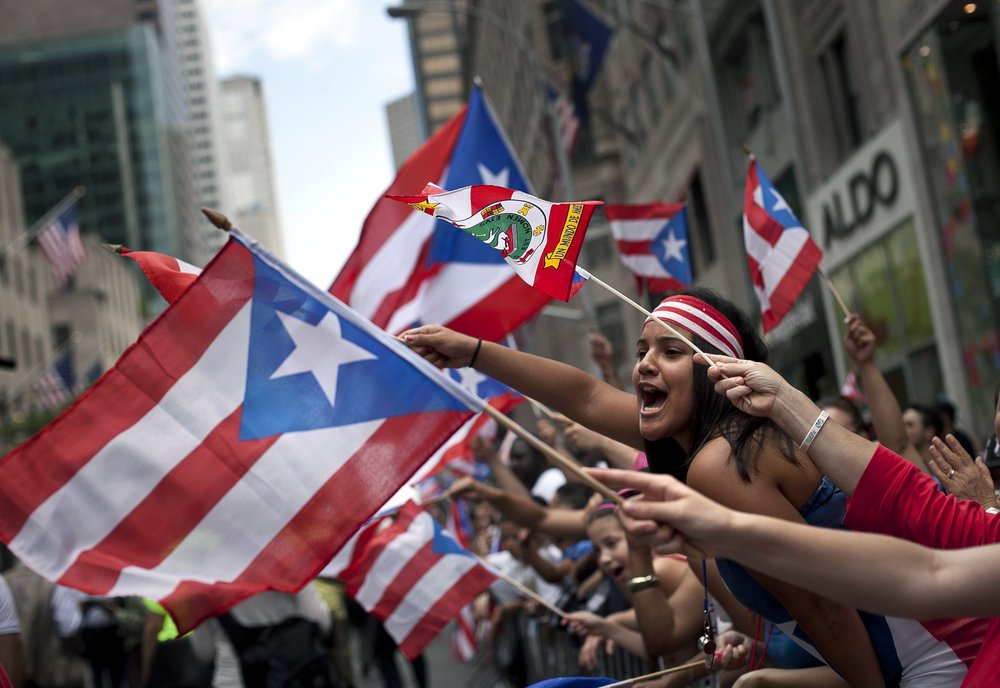 People wave Puerto Rican flags in New York City.